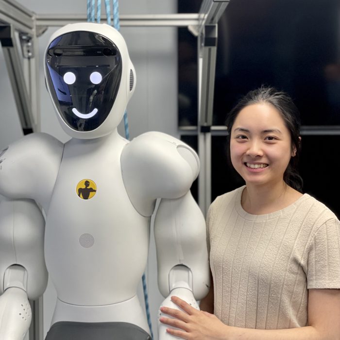 A Halodi Robotics engineer with the EVE humanoid robot
